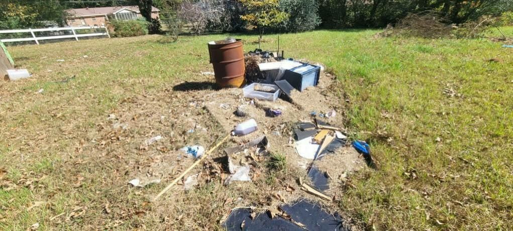 A backyard debris pile before removal