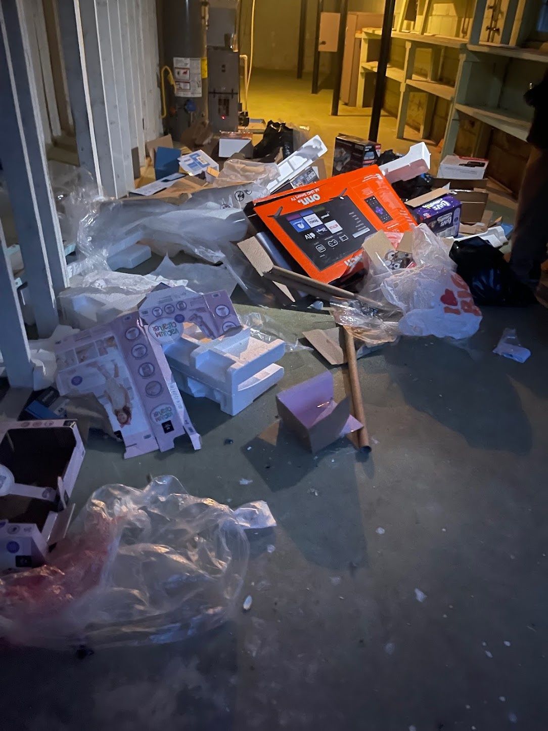 Debris, boxes and packaging scattered across a room