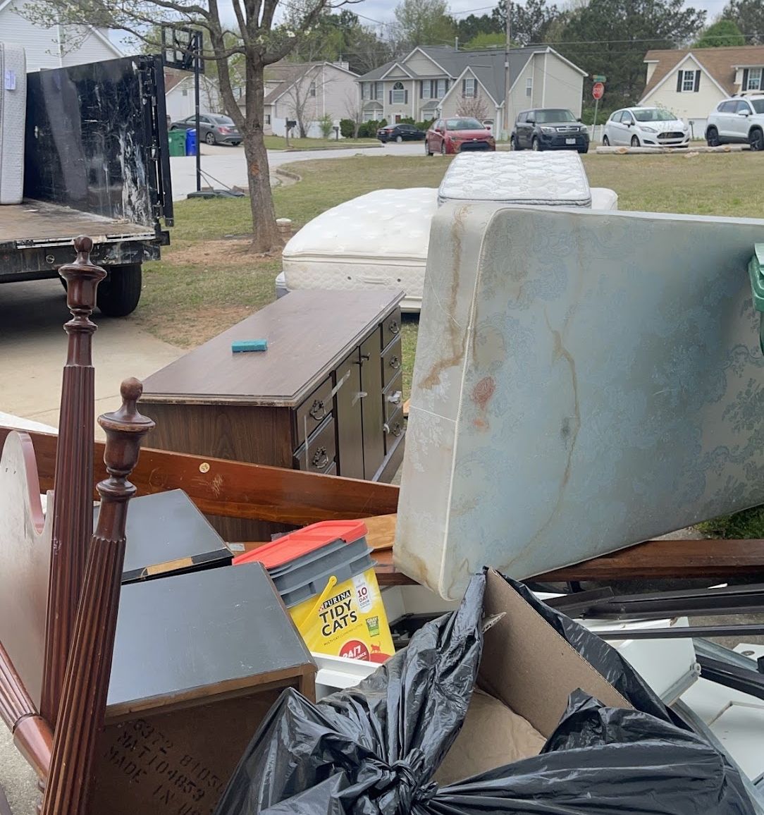 Wakanda Junk Removal crew hauling junk in Atlanta, GA