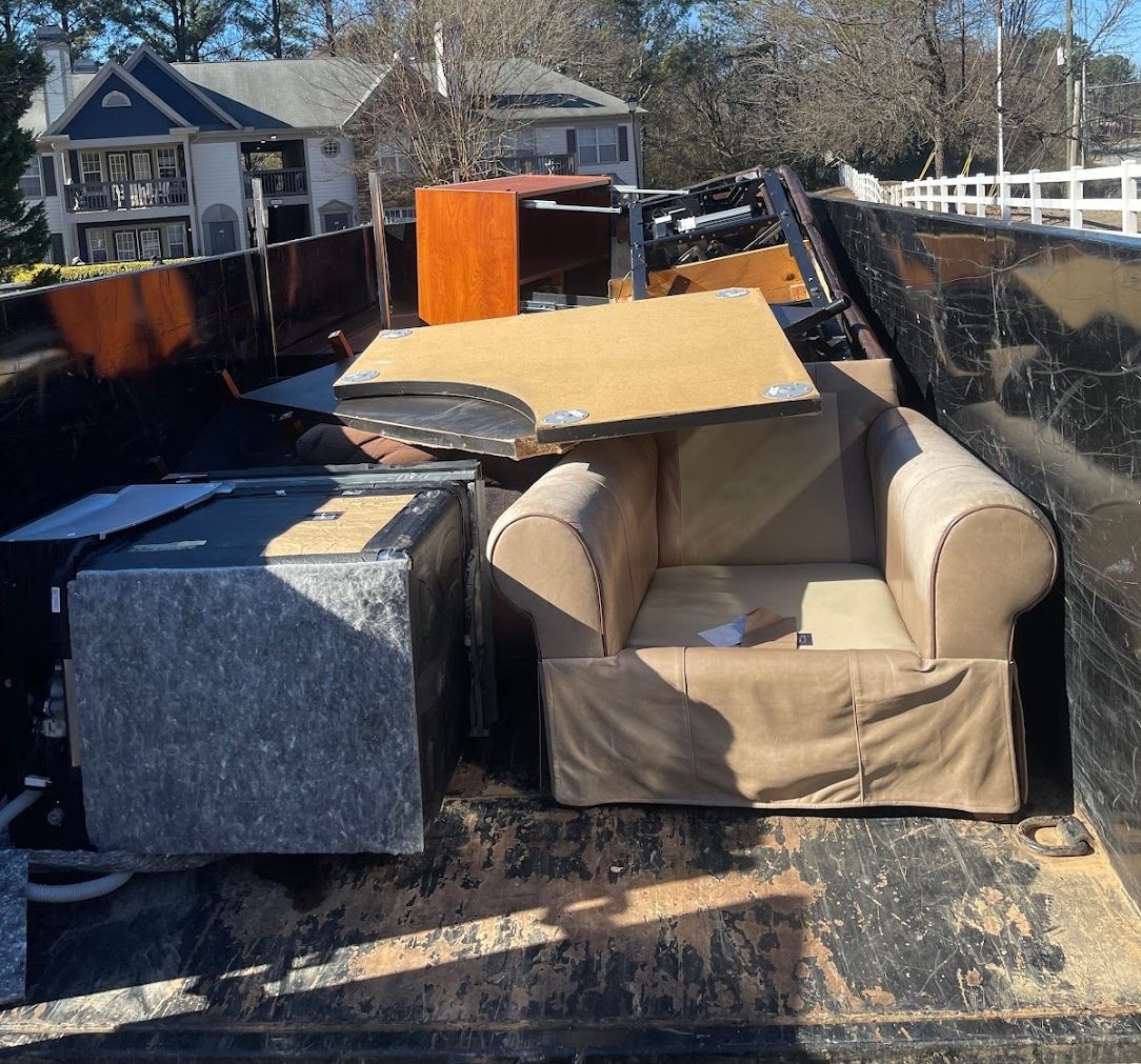 Wakanda Junk Removal crew hauling junk in Atlanta, GA